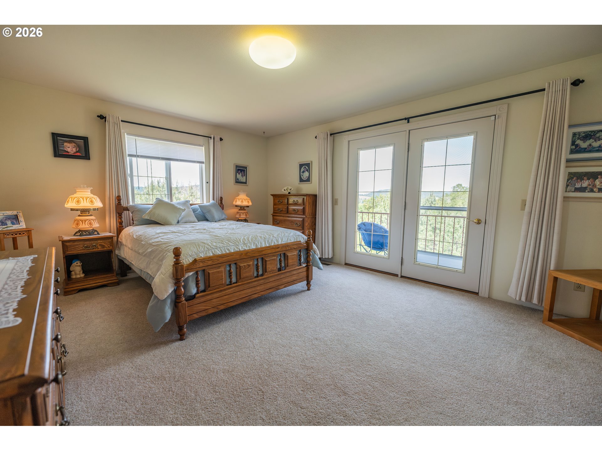 489 Fir Vista Road Sutherlin, OR 97479 - Photo 21 of 47 a spacious bedroom with a bed and a window
