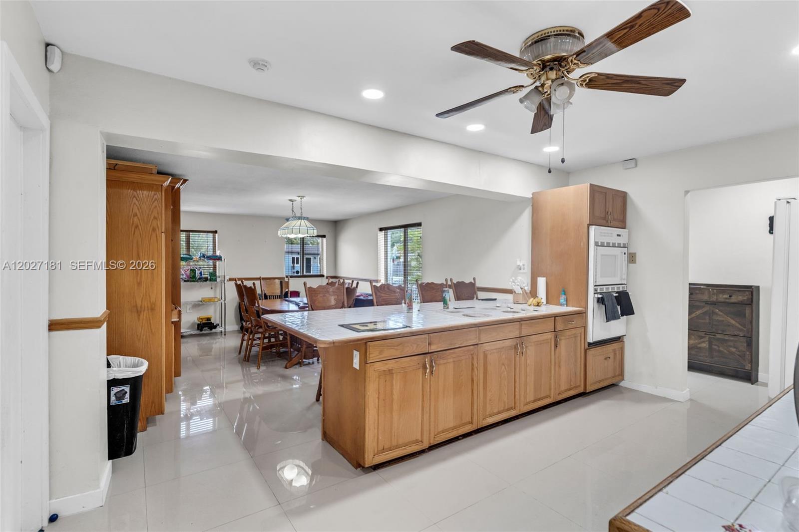 15440 Southwest 294th Terrace Homestead, FL 33033 - Photo 2 of 31 a large white kitchen with a large counter top appliances and cabinets