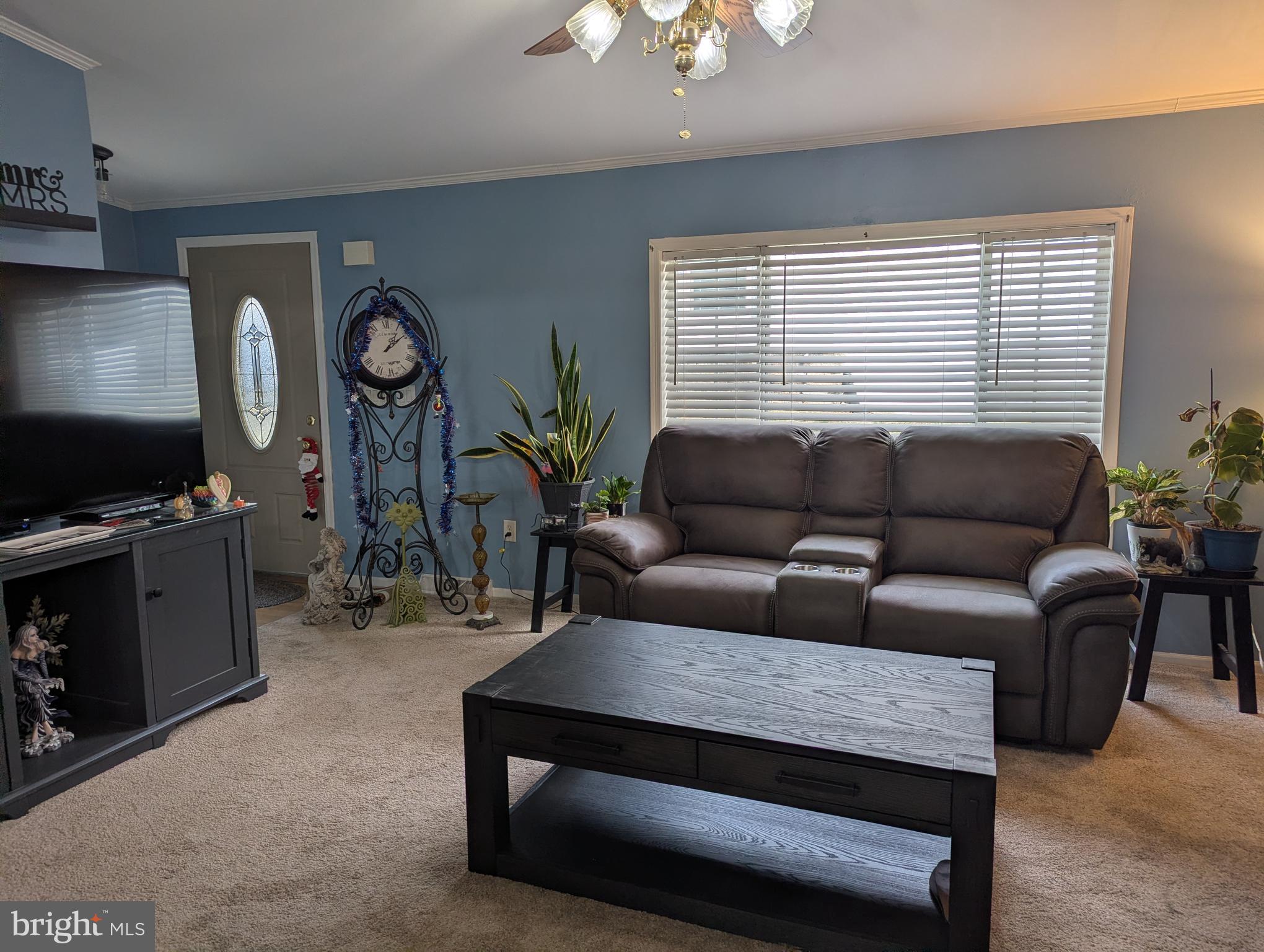 248 Williams Lane Red Hill, PA 18076 - Photo 4 of 37 a living room with furniture a flat screen tv and a large window