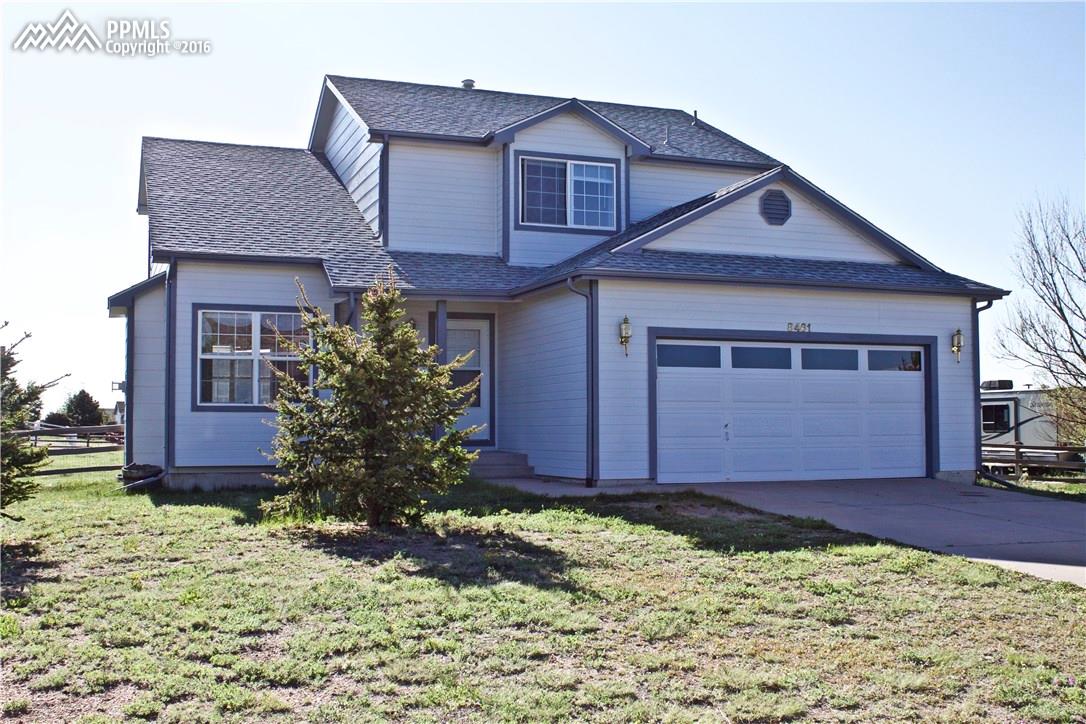 8461 Saddleman Road Peyton, CO 80831 - Photo 1 of 26 4 bedroom 4 bath home with finished basement and 2 car garage. Over 2500 Square feet. Situated on 1/2 acre lot.