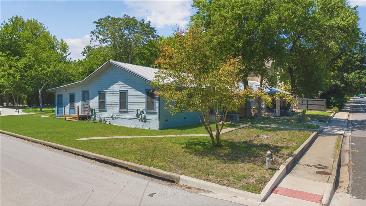 4900 Duval Street Austin, TX 78751 - Photo 6 of 25 Central Austin corner-lot opportunity in 78751 with alley access and a flexible layout. The property includes the original main house plus an attached rear apartment with a separate exterior entrance, offering options for guest space, work-from-home use, or future reimagining.