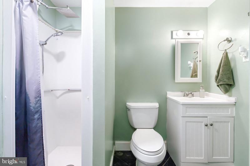 517 Golden Street Lititz, PA 17543 - Photo 11 of 14 a bathroom with a toilet sink and mirror