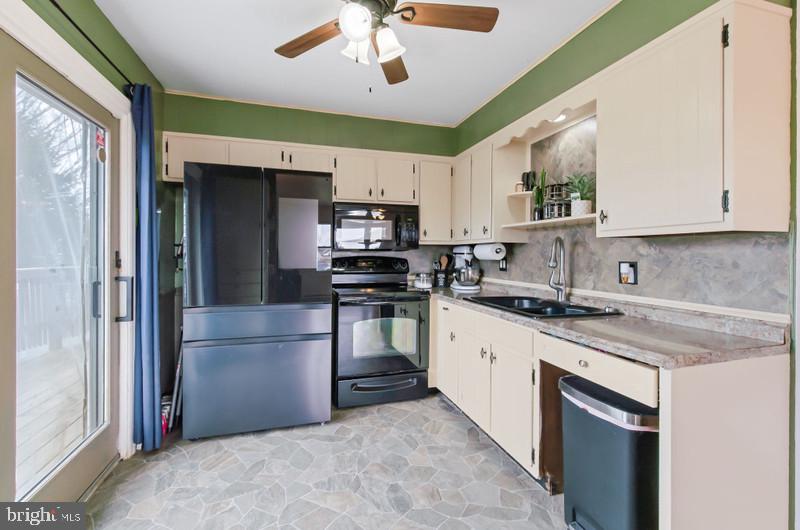 517 Golden Street Lititz, PA 17543 - Photo 5 of 14 a kitchen with a refrigerator sink and cabinets