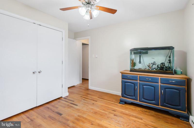 517 Golden Street Lititz, PA 17543 - Photo 7 of 14 a view of an empty room with wooden floor and a ceiling fan