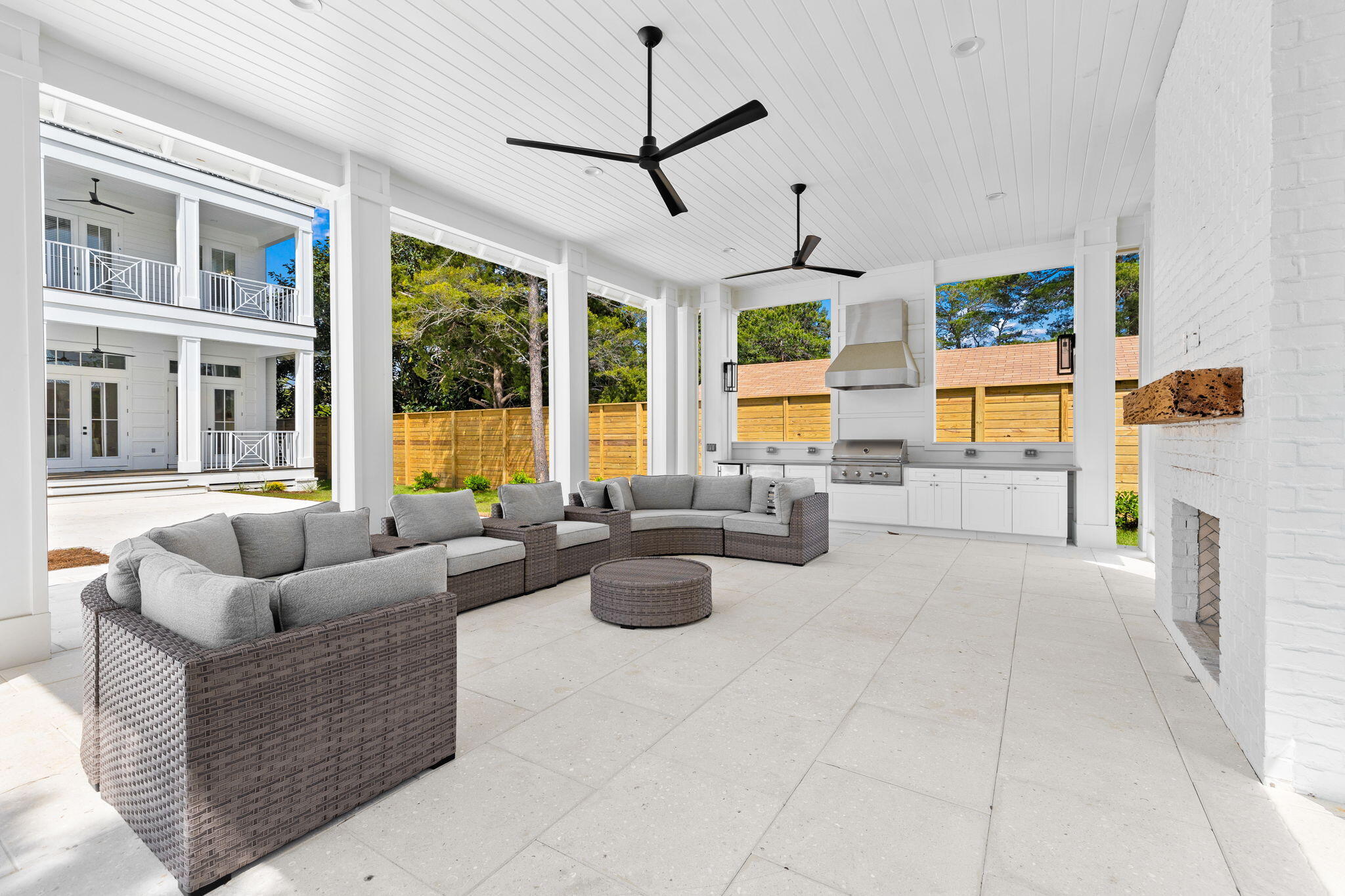 161 Rolling Dunes Drive Santa Rosa Beach, FL 32459 - Photo 14 of 64 a living room with patio furniture and floor to ceiling windows