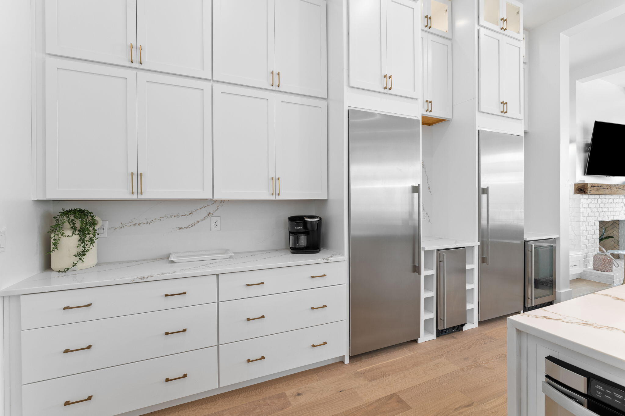 161 Rolling Dunes Drive Santa Rosa Beach, FL 32459 - Photo 25 of 64 a kitchen with white cabinets and refrigerator