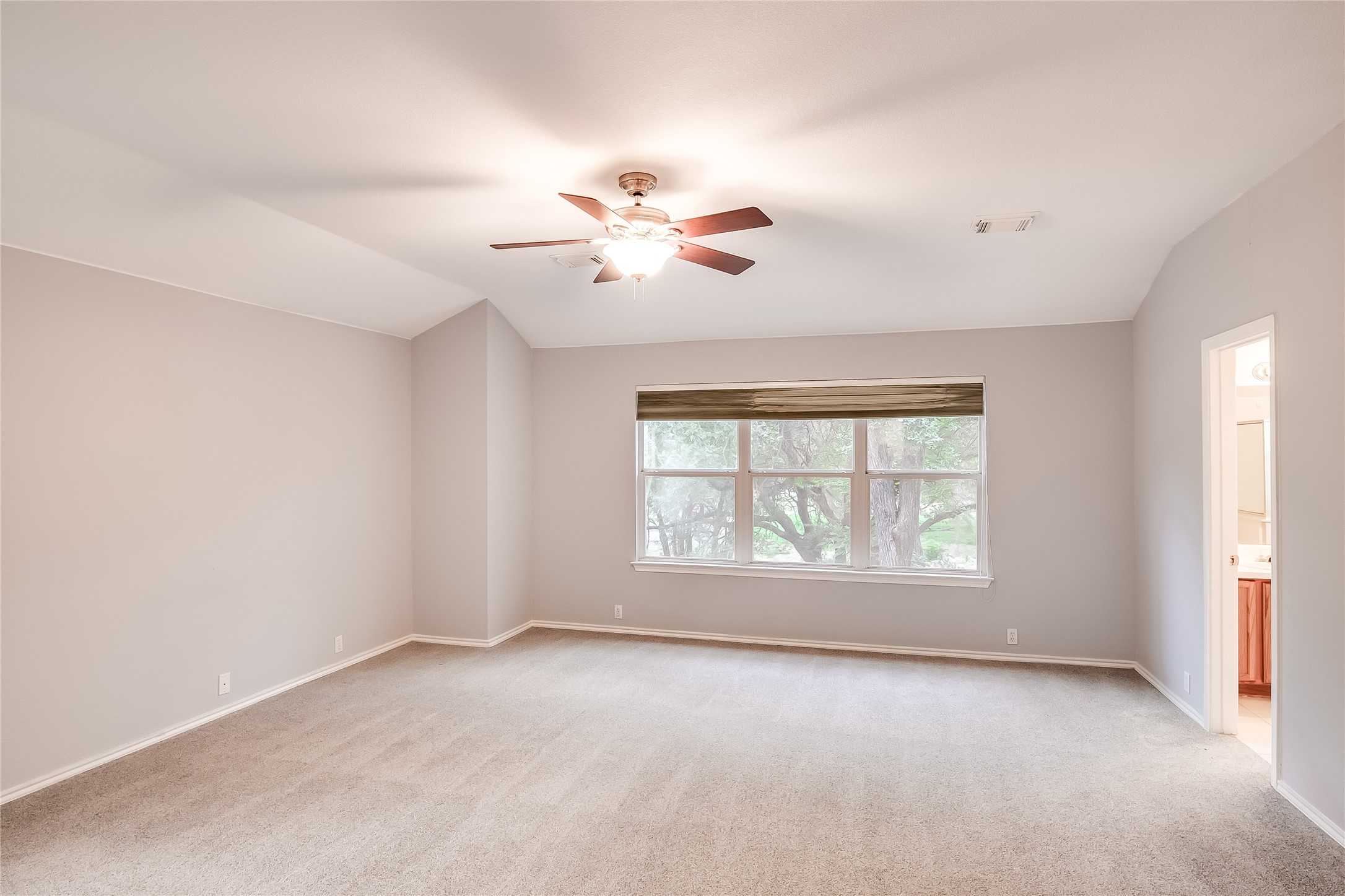 1204 Mathias Street Cedar Park, TX 78613 - Photo 18 of 32 an empty room with chandelier fan and windows