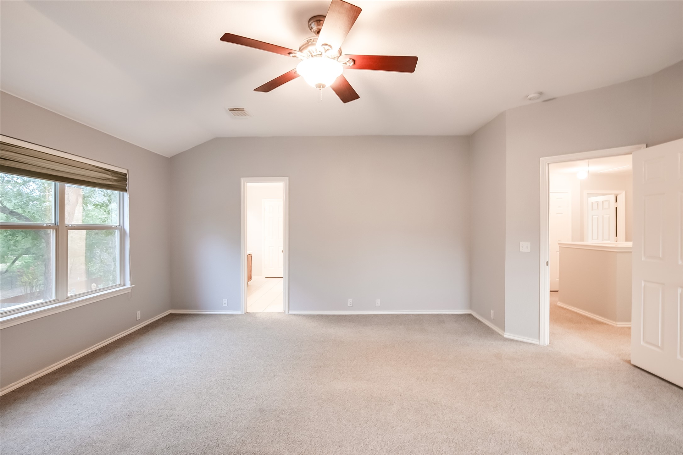 1204 Mathias Street Cedar Park, TX 78613 - Photo 20 of 32 an empty room with windows and fan