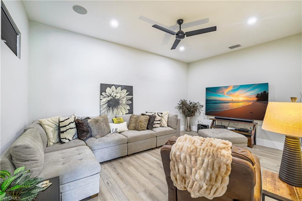 4269 15th Avenue Southwest Naples, FL 34116 - Photo 16 of 30 a living room with furniture and a flat screen tv