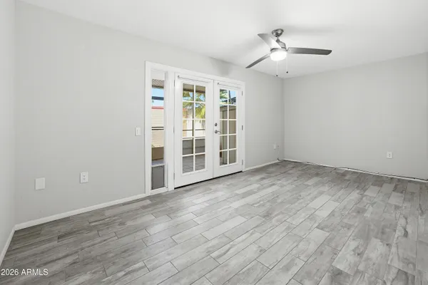wooden floor in an empty room with a window