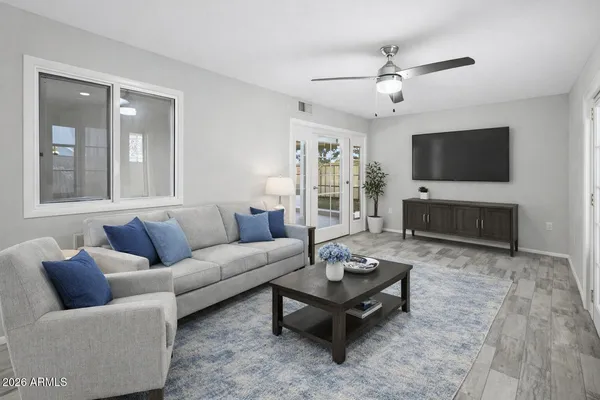 a living room with furniture and a flat screen tv