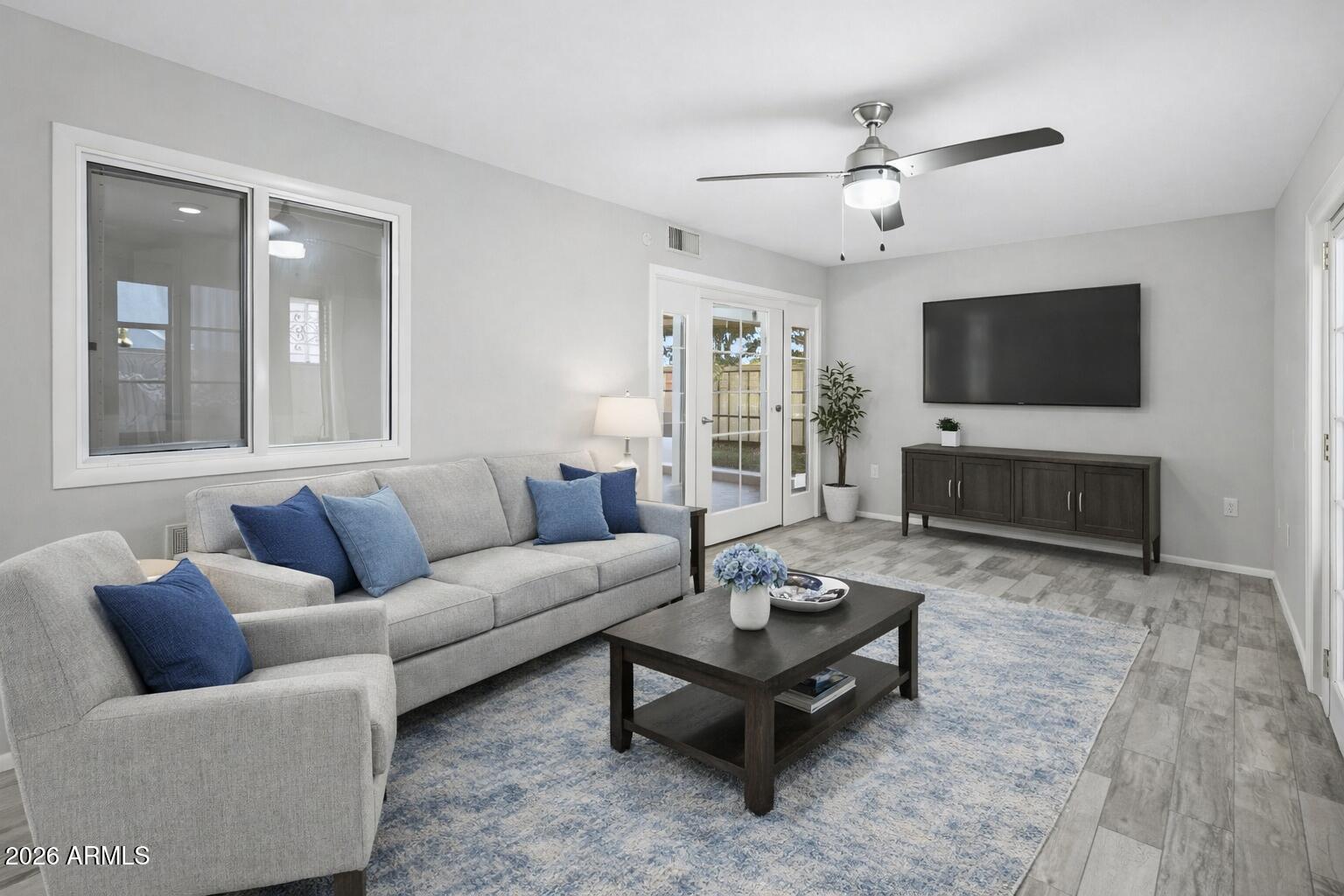 10030 West Royal Oak Road, Unit L Sun City, AZ 85351 - Photo 15 of 30 a living room with furniture and a flat screen tv