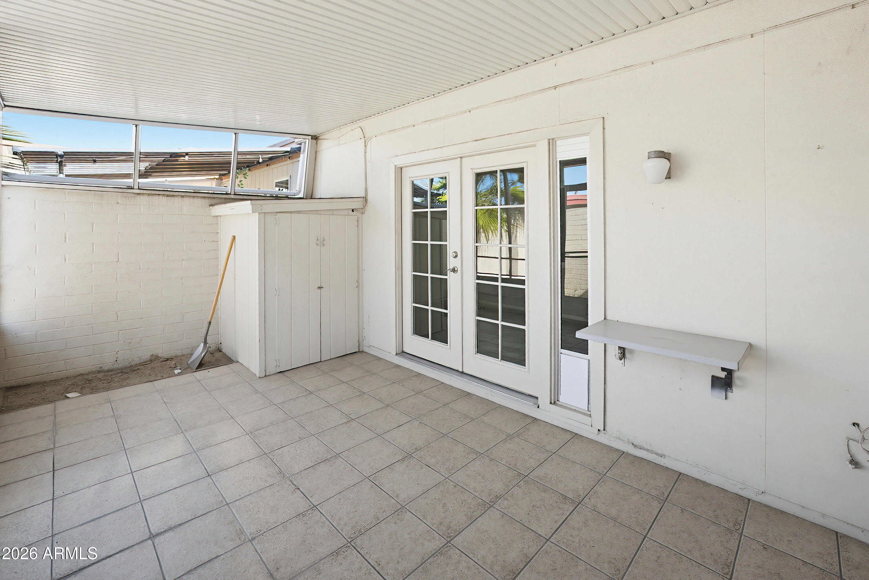 10030 West Royal Oak Road, Unit L Sun City, AZ 85351 - Photo 25 of 30 a view of a room with white walls