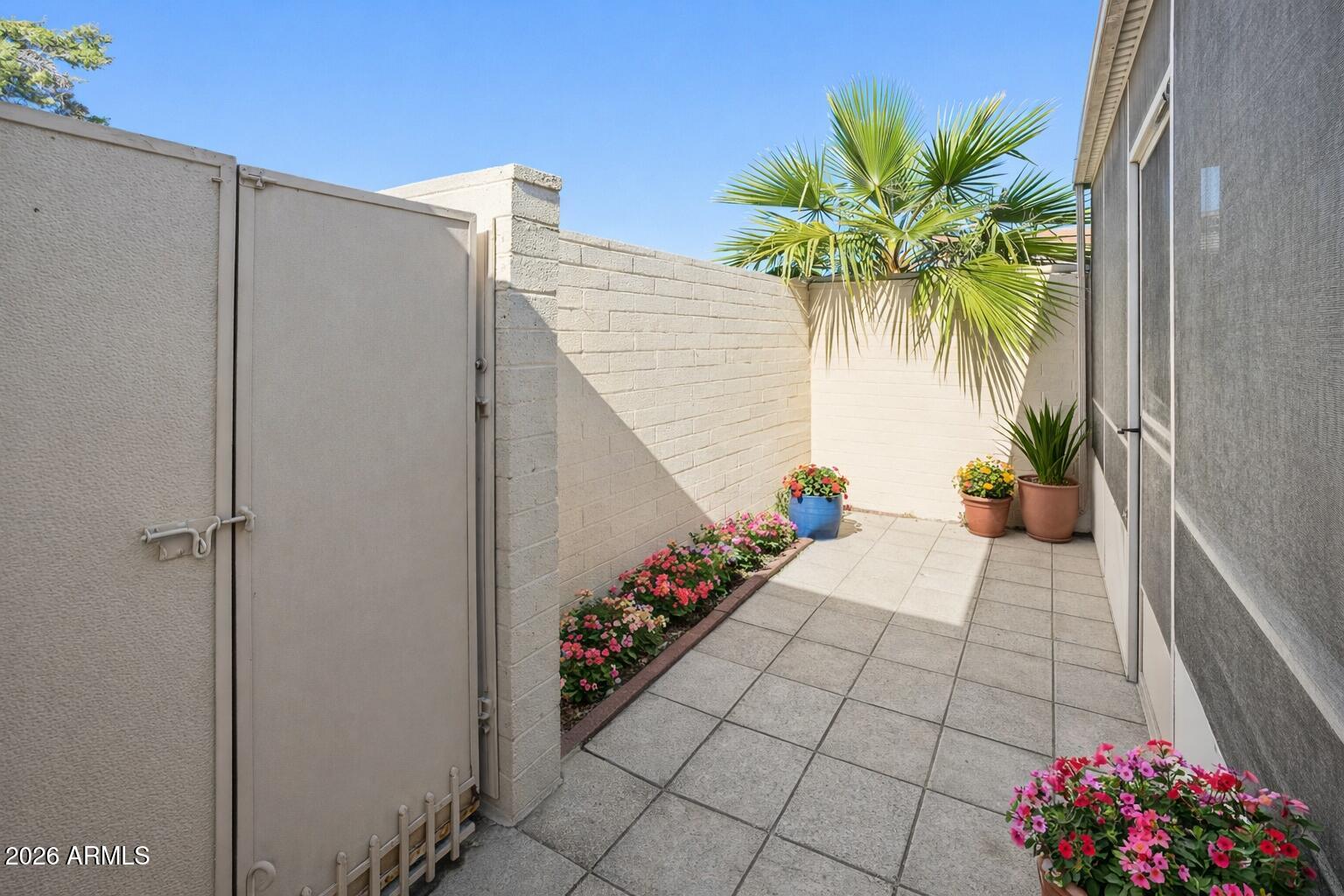 10030 West Royal Oak Road, Unit L Sun City, AZ 85351 - Photo 26 of 30 a view of balcony with potted plants