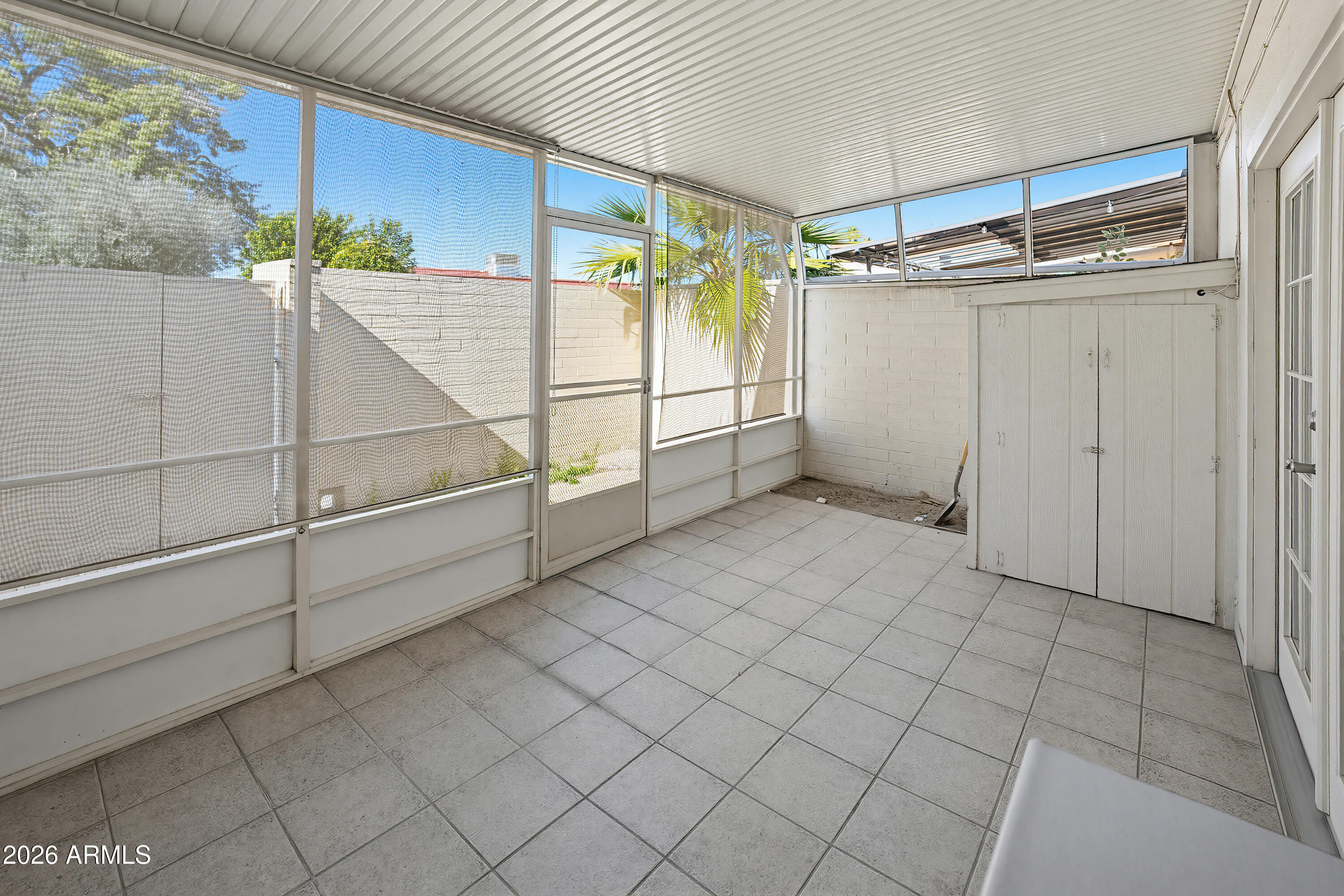 10030 West Royal Oak Road, Unit L Sun City, AZ 85351 - Photo 27 of 30 a view of a room with racks on the wall
