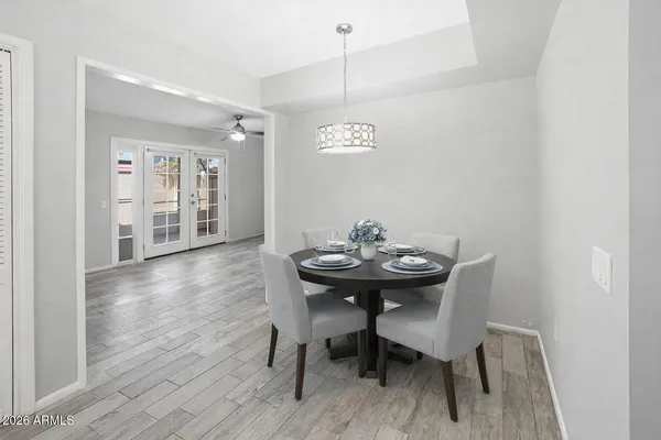a view of a dining room with furniture and wooden floor
