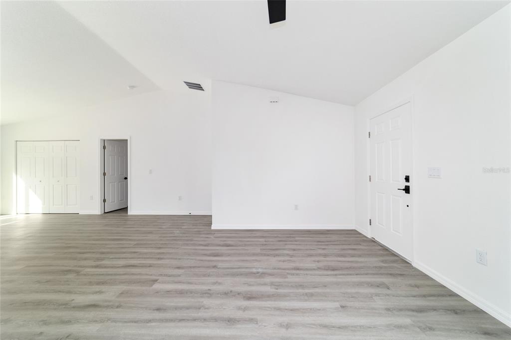 1922 Southwest Little Cliffs Drive Dunnellon, FL 34431 - Photo 11 of 37 a view of an empty room with wooden floor