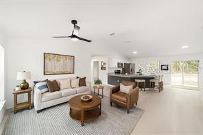 1922 Southwest Little Cliffs Drive Dunnellon, FL 34431 - Photo 2 of 37 a living room with furniture and a chandelier