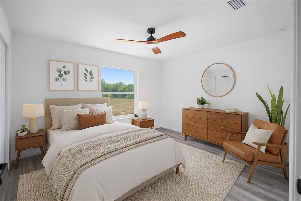 1922 Southwest Little Cliffs Drive Dunnellon, FL 34431 - Photo 3 of 37 a bed room with a bed and a chair