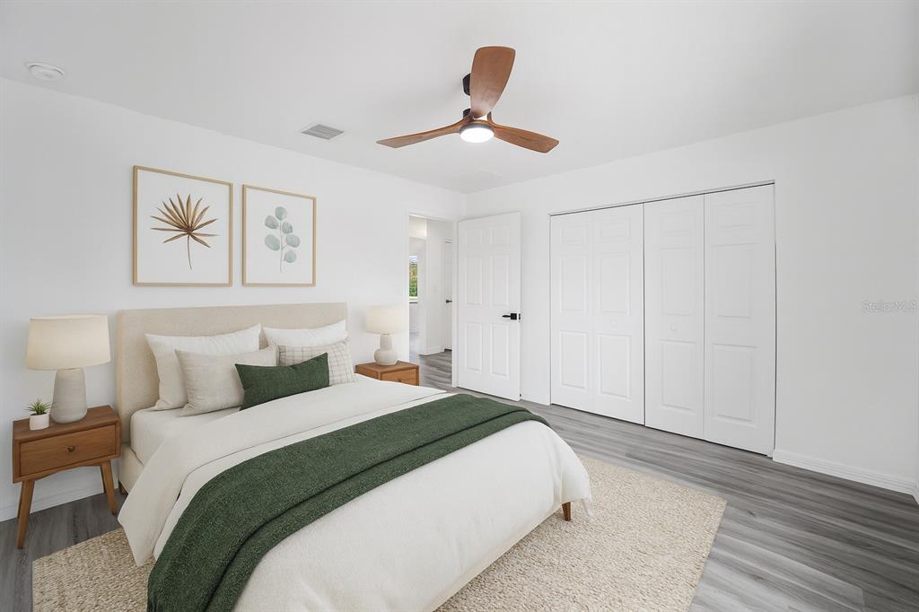 1922 Southwest Little Cliffs Drive Dunnellon, FL 34431 - Photo 4 of 37 a bedroom with a bed and a painting on the wall