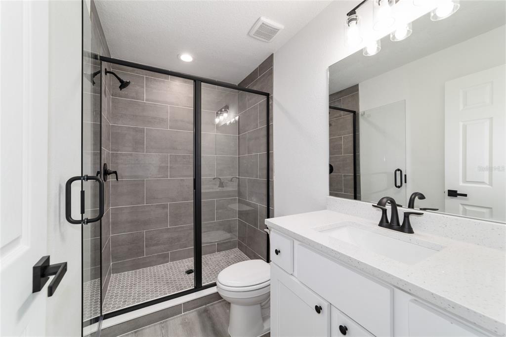1922 Southwest Little Cliffs Drive Dunnellon, FL 34431 - Photo 7 of 37 a bathroom with a sink toilet and shower