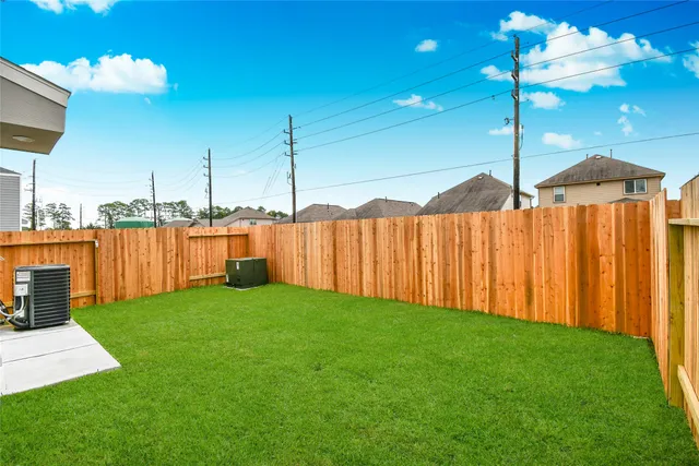 a view of a backyard with potted plants