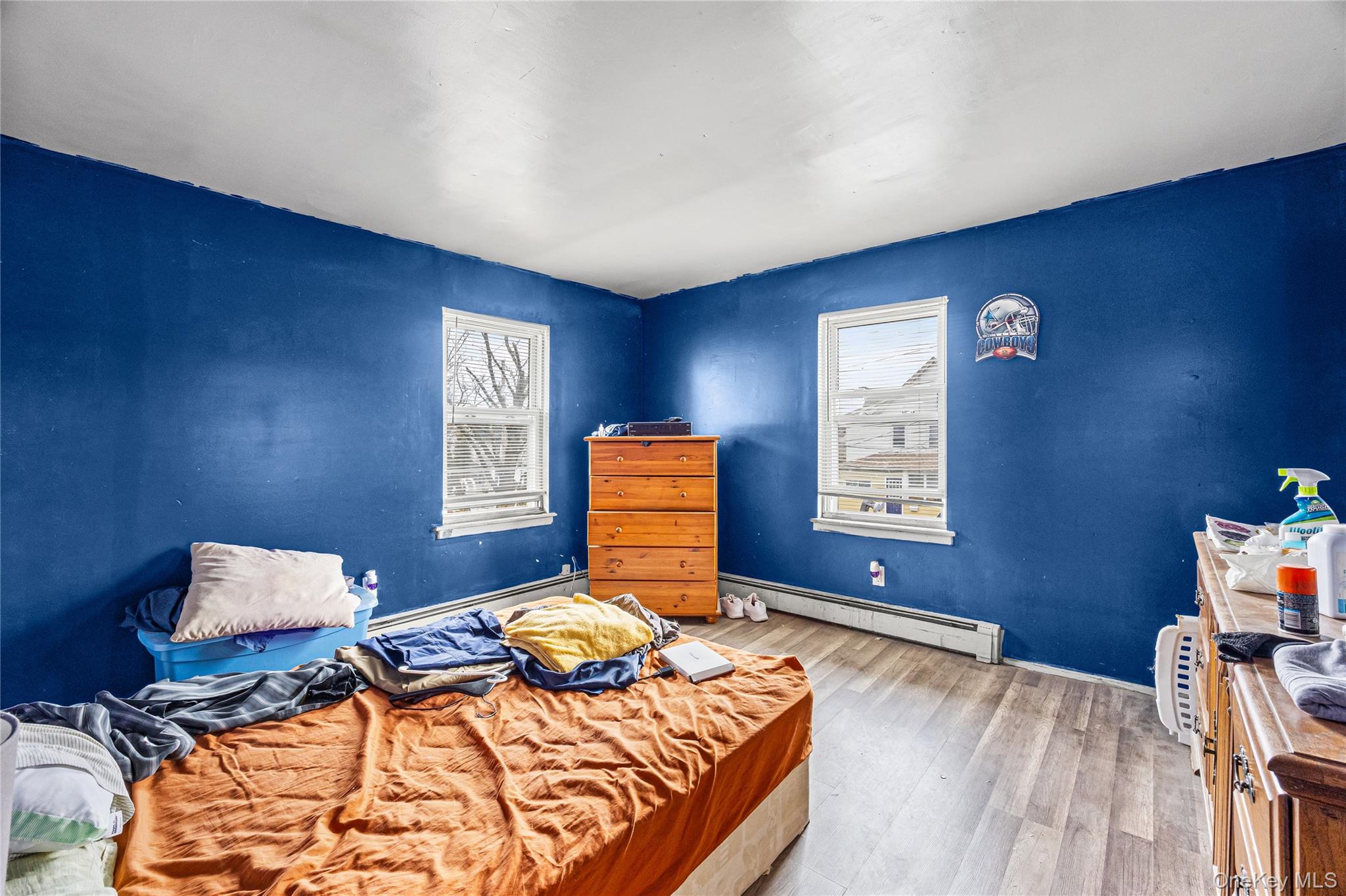 34 Mervin Street Inwood, NY 11096 - Photo 12 of 26 a bedroom with a bed and wooden floor