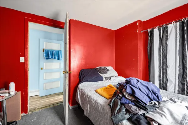 a bedroom with a bed and a closet