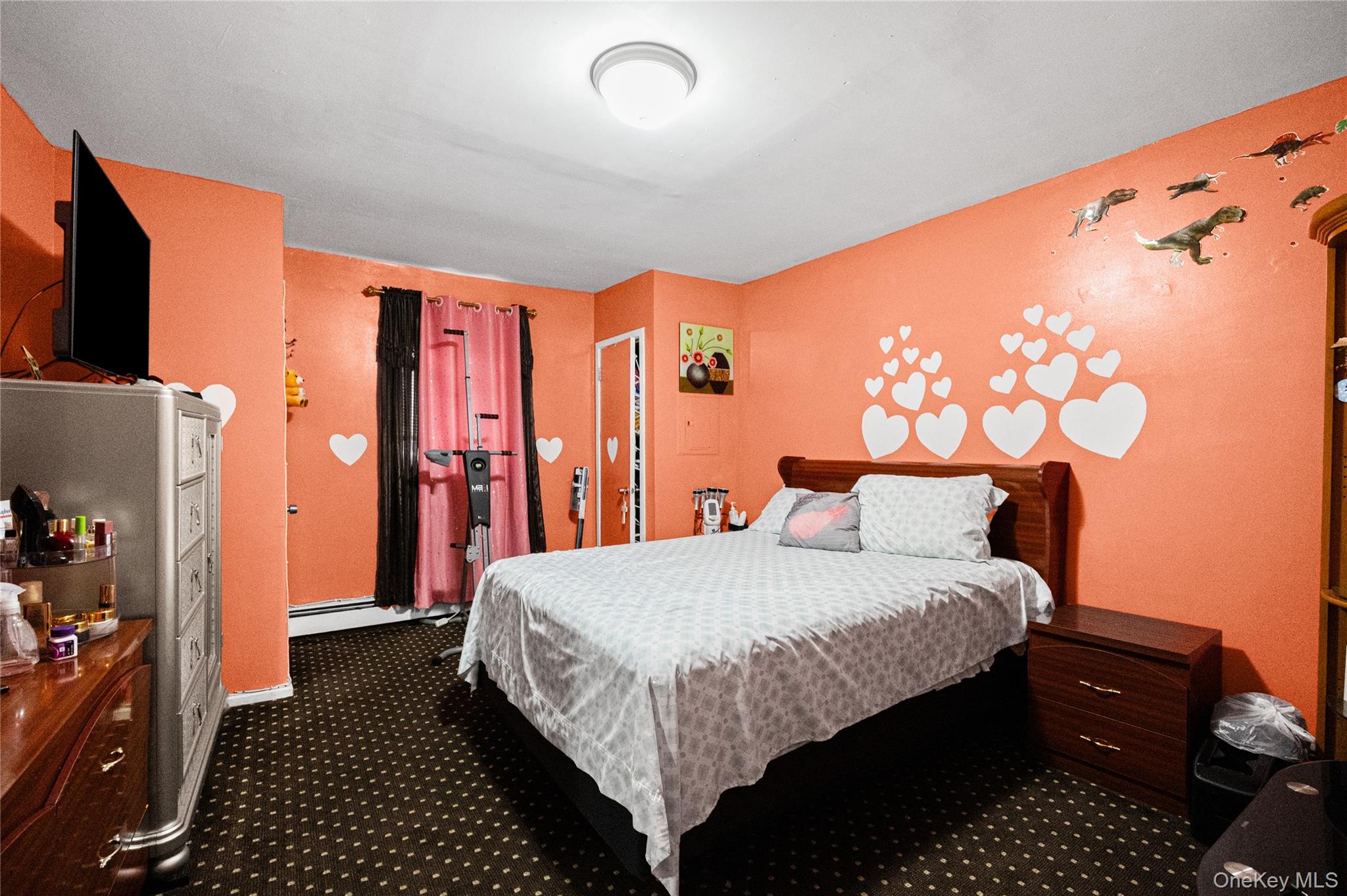 34 Mervin Street Inwood, NY 11096 - Photo 18 of 26 a bedroom with a bed and a dresser