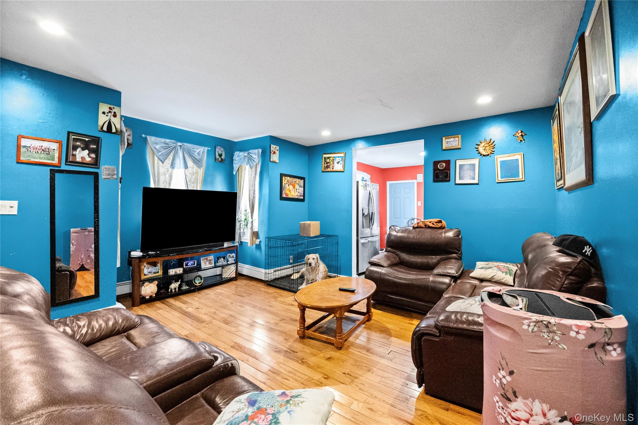 34 Mervin Street Inwood, NY 11096 - Photo 19 of 26 a living room with furniture and a flat screen tv