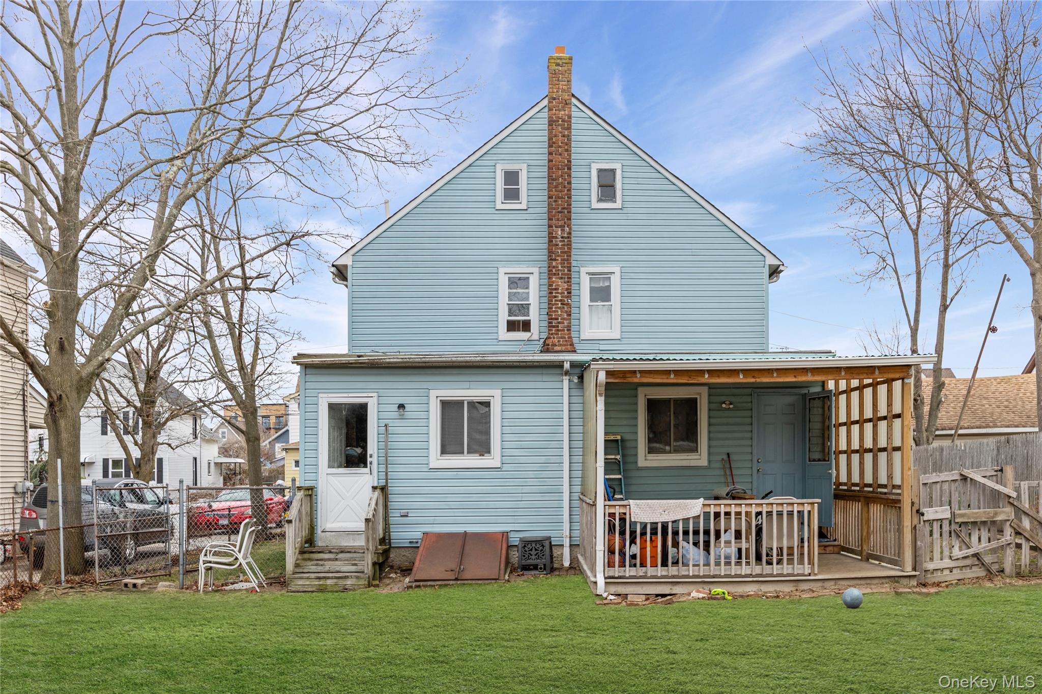 34 Mervin Street Inwood, NY 11096 - Photo 21 of 26 a front view of a house with a garden