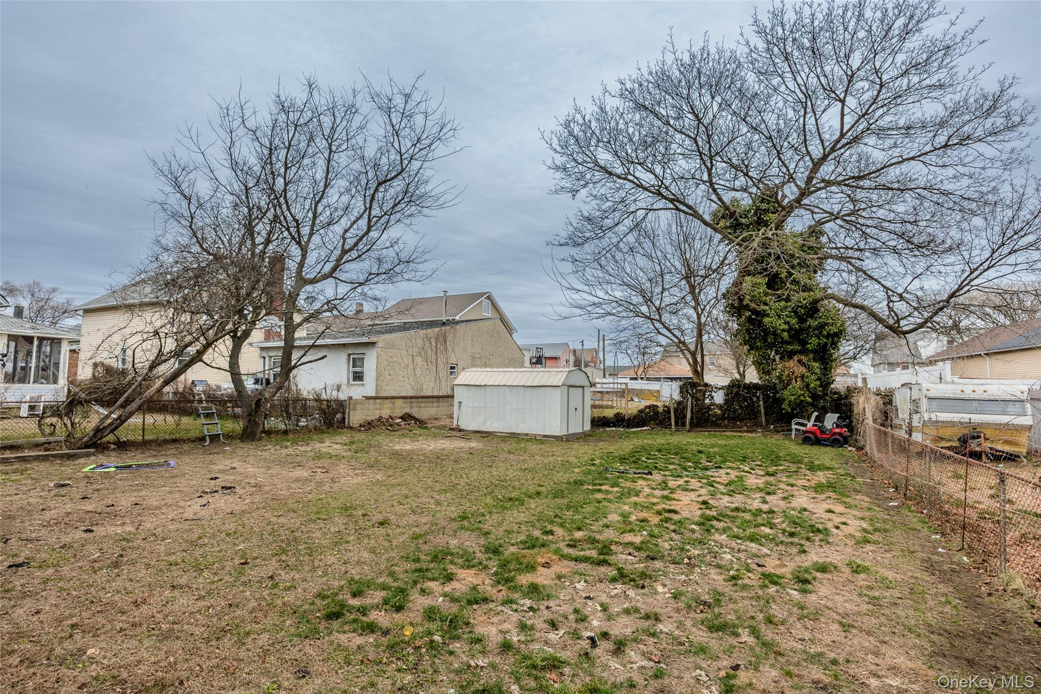 34 Mervin Street Inwood, NY 11096 - Photo 23 of 26 a view of a house with a yard