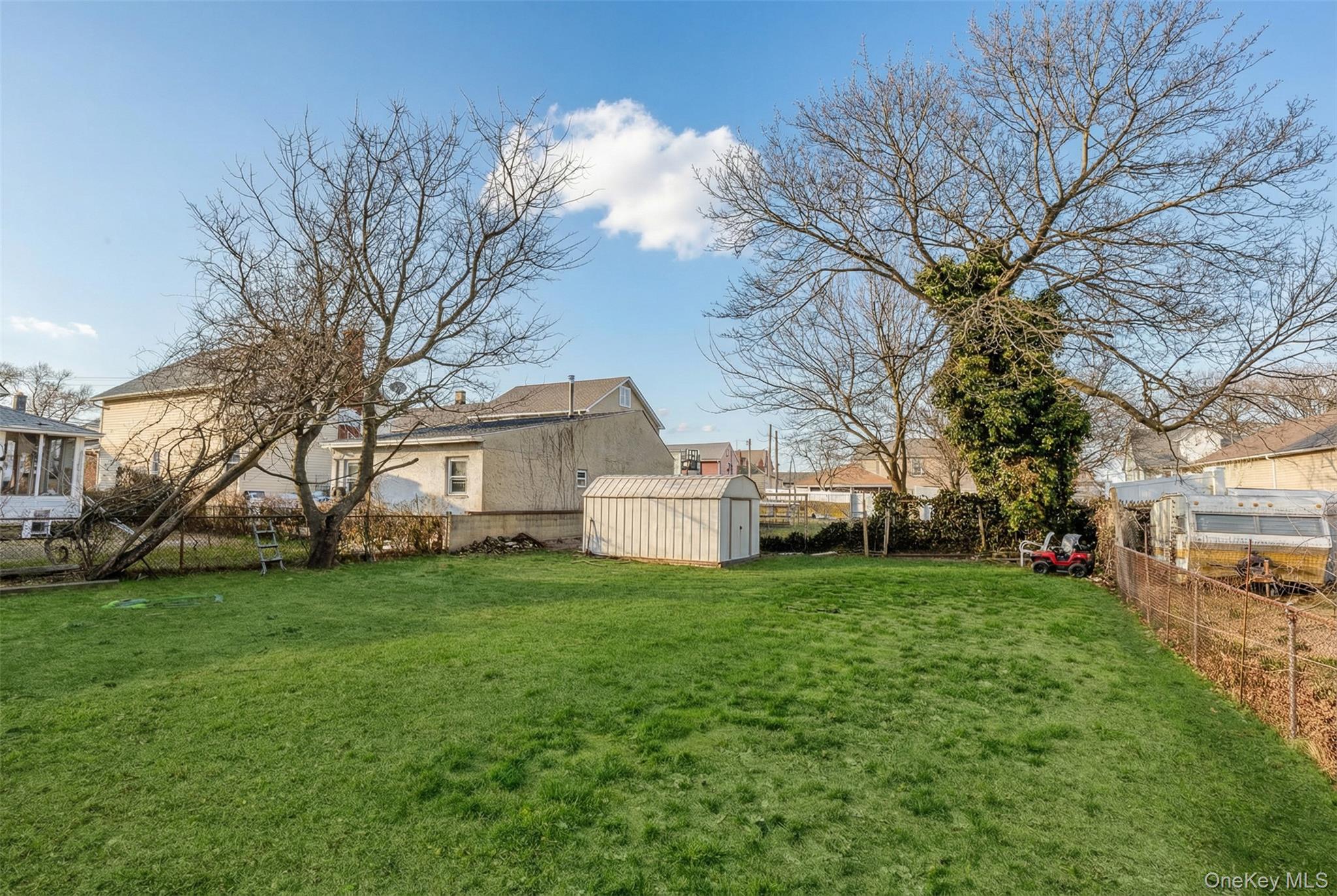 34 Mervin Street Inwood, NY 11096 - Photo 24 of 26 a view of a house with a yard
