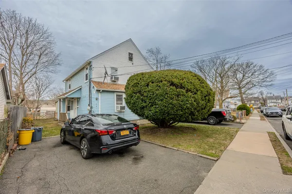 a car parked in front of a house