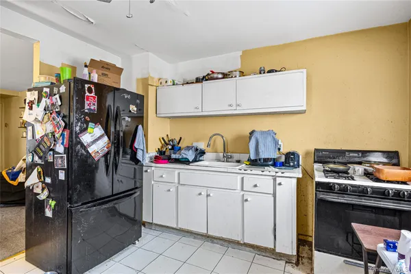 a kitchen with stainless steel appliances granite countertop a stove and a refrigerator