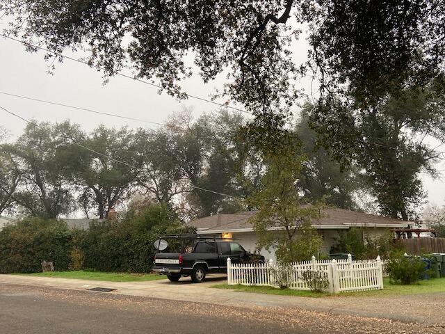 1142 Echo Road Redding, CA 96002 - Photo 1 of 1 a building with trees in front of it