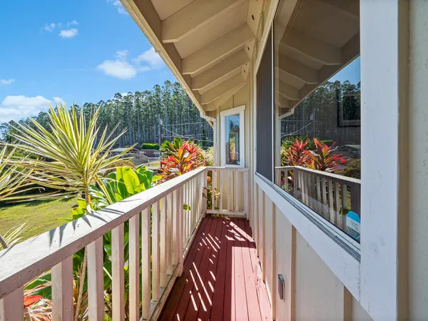 a view of balcony with wooden floor