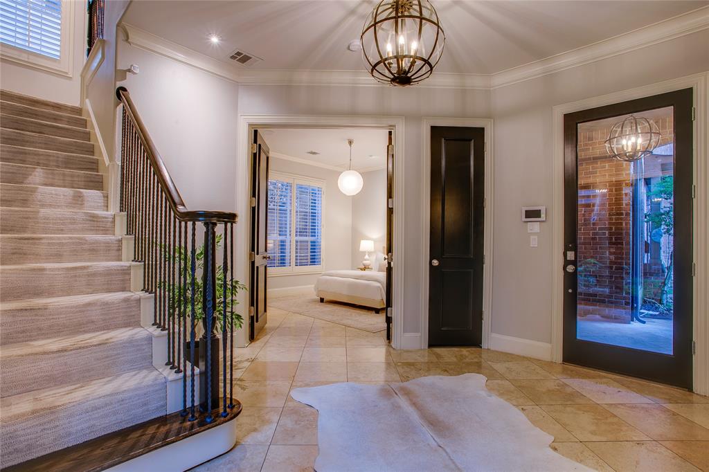3810 Hawthorne Avenue Dallas, TX 75219 - Photo 12 of 40 a view of a hallway with wooden floor and staircase
