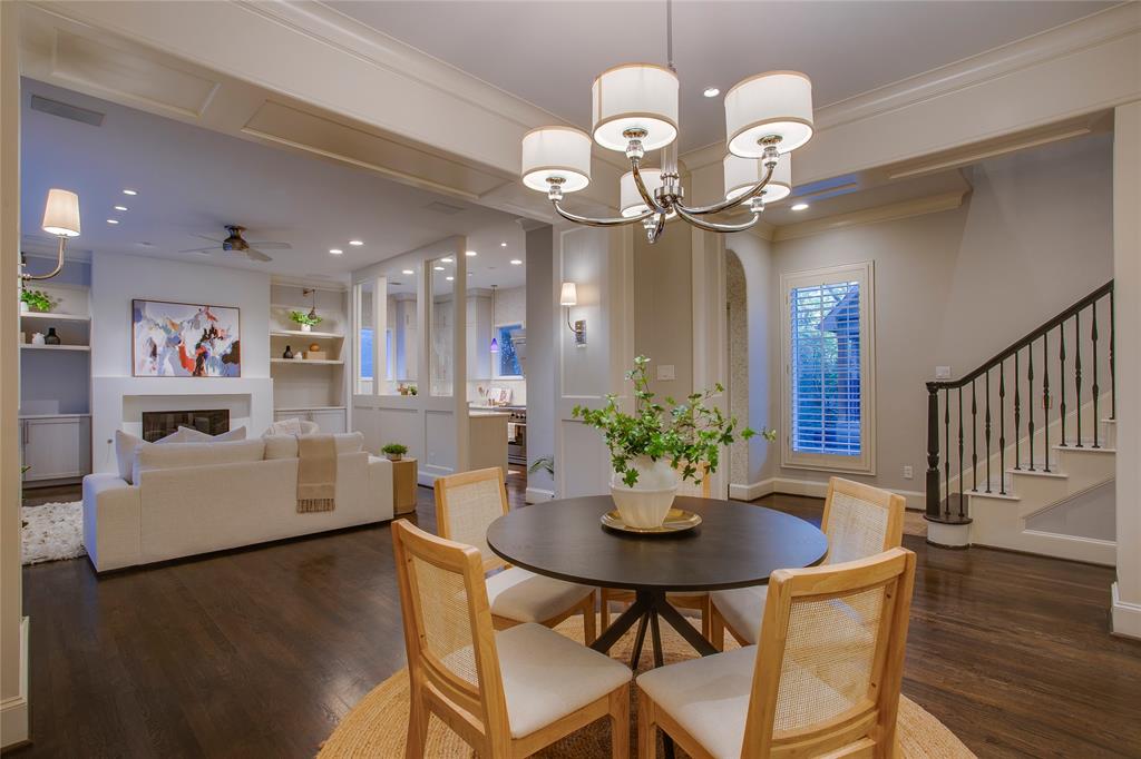 3810 Hawthorne Avenue Dallas, TX 75219 - Photo 13 of 40 a view of a dining room and a wooden floor