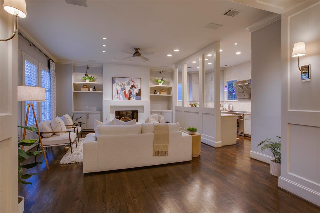 3810 Hawthorne Avenue Dallas, TX 75219 - Photo 14 of 40 a living room with fireplace furniture and a wooden floor