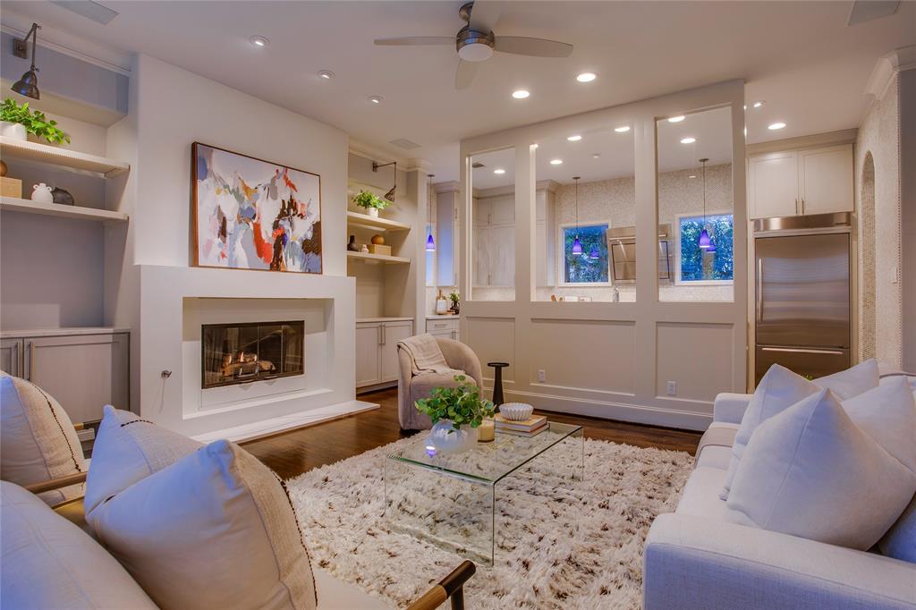 3810 Hawthorne Avenue Dallas, TX 75219 - Photo 15 of 40 a living room with furniture and a fireplace