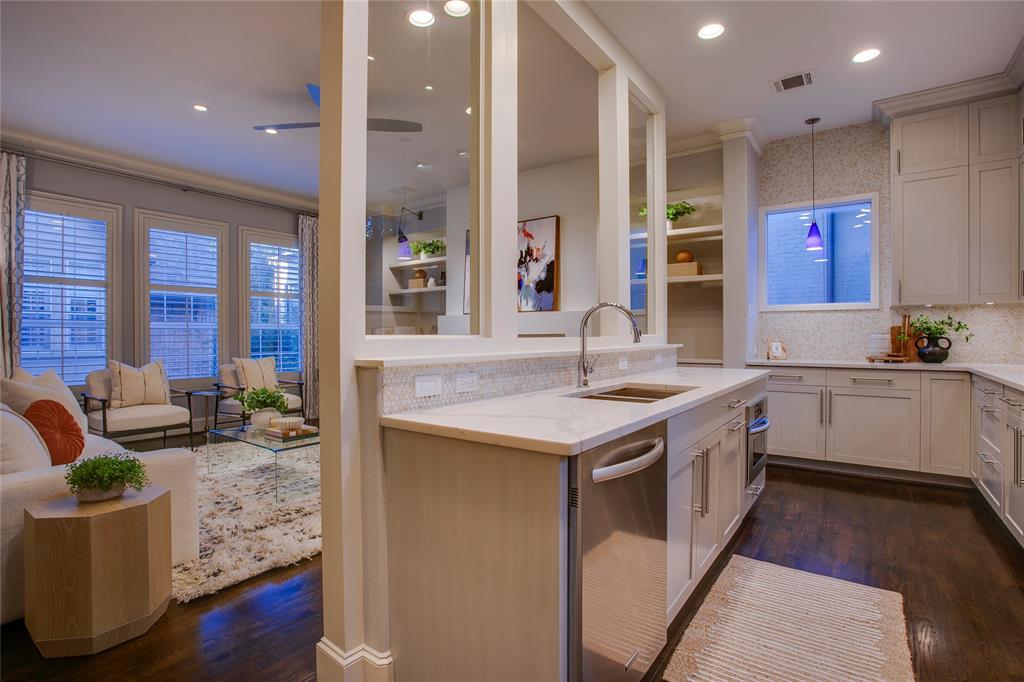 3810 Hawthorne Avenue Dallas, TX 75219 - Photo 19 of 40 a kitchen with a stove a sink and a refrigerator