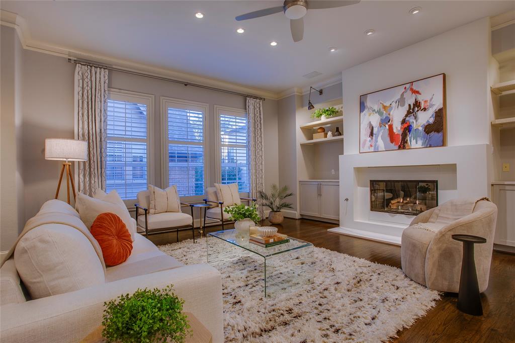 3810 Hawthorne Avenue Dallas, TX 75219 - Photo 2 of 40 a living room with furniture large window and a fireplace