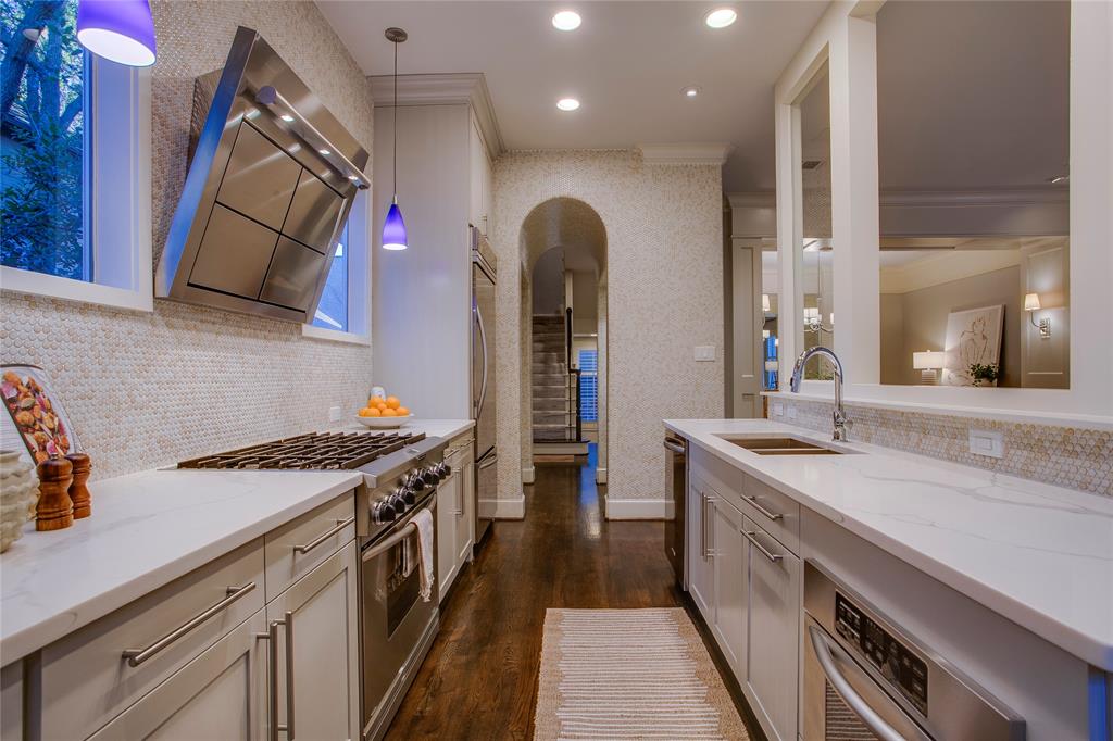 3810 Hawthorne Avenue Dallas, TX 75219 - Photo 21 of 40 a kitchen with a stove and a sink