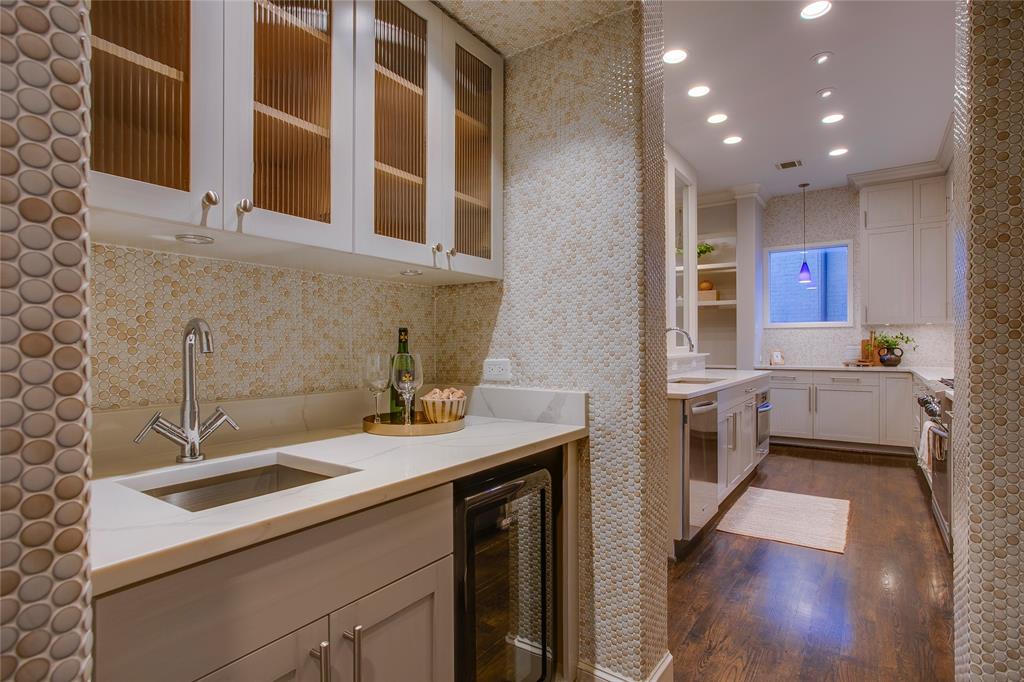 3810 Hawthorne Avenue Dallas, TX 75219 - Photo 24 of 40 a kitchen with a sink stove and cabinets