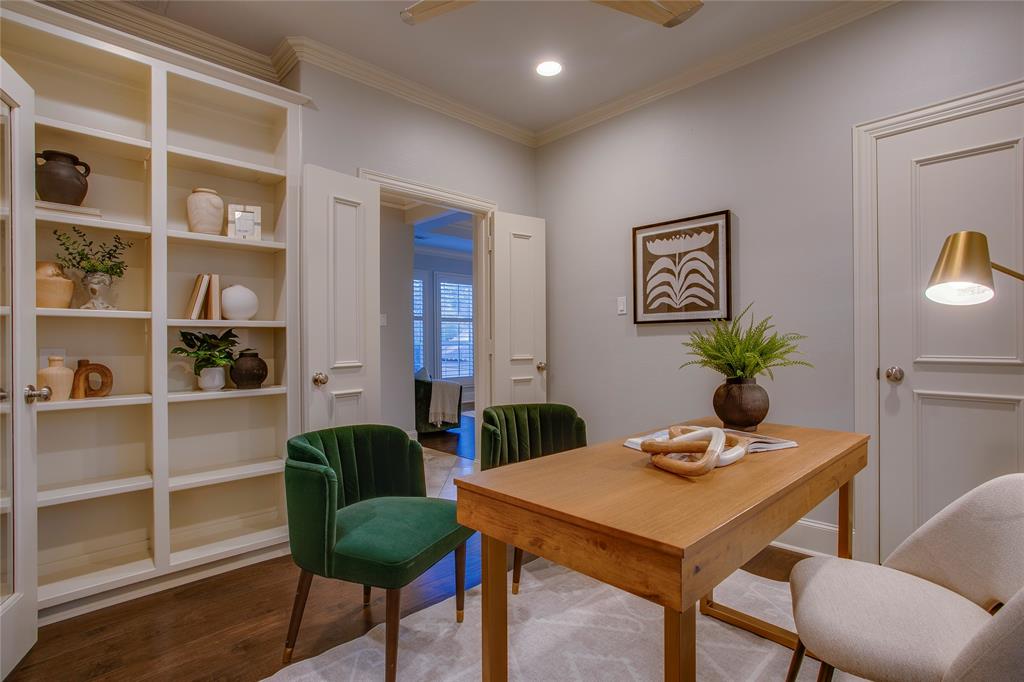 3810 Hawthorne Avenue Dallas, TX 75219 - Photo 25 of 40 a view of a dining room with furniture and a potted plant