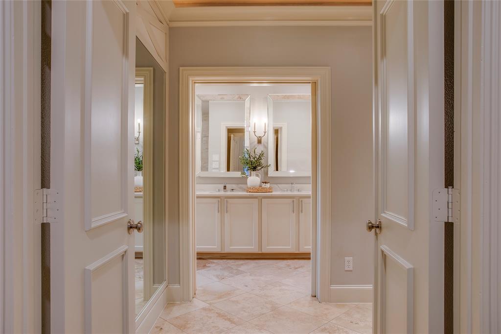 3810 Hawthorne Avenue Dallas, TX 75219 - Photo 26 of 40 a view of a mirror and a bathroom sink