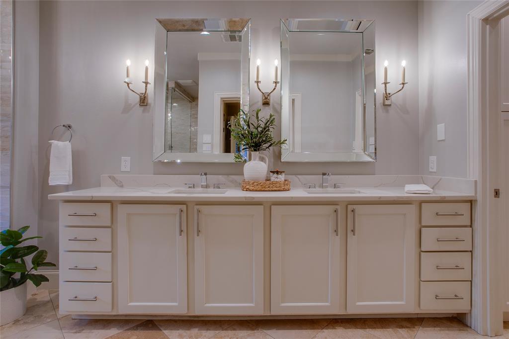 3810 Hawthorne Avenue Dallas, TX 75219 - Photo 27 of 40 a bathroom with a sink and a mirror