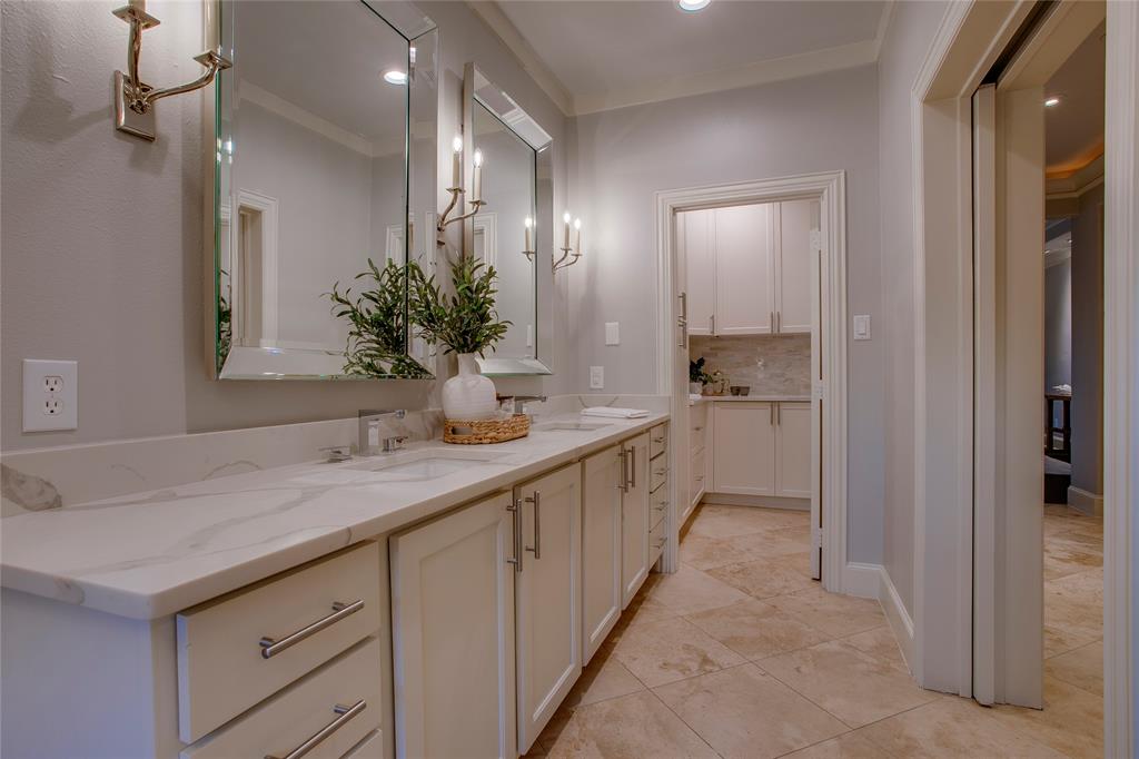 3810 Hawthorne Avenue Dallas, TX 75219 - Photo 29 of 40 a bathroom with a sink and a mirror