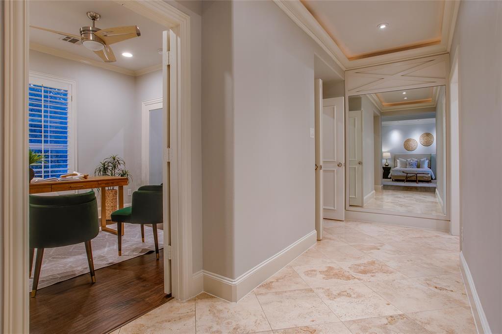 3810 Hawthorne Avenue Dallas, TX 75219 - Photo 33 of 40 a view of a hallway and dining room with furniture